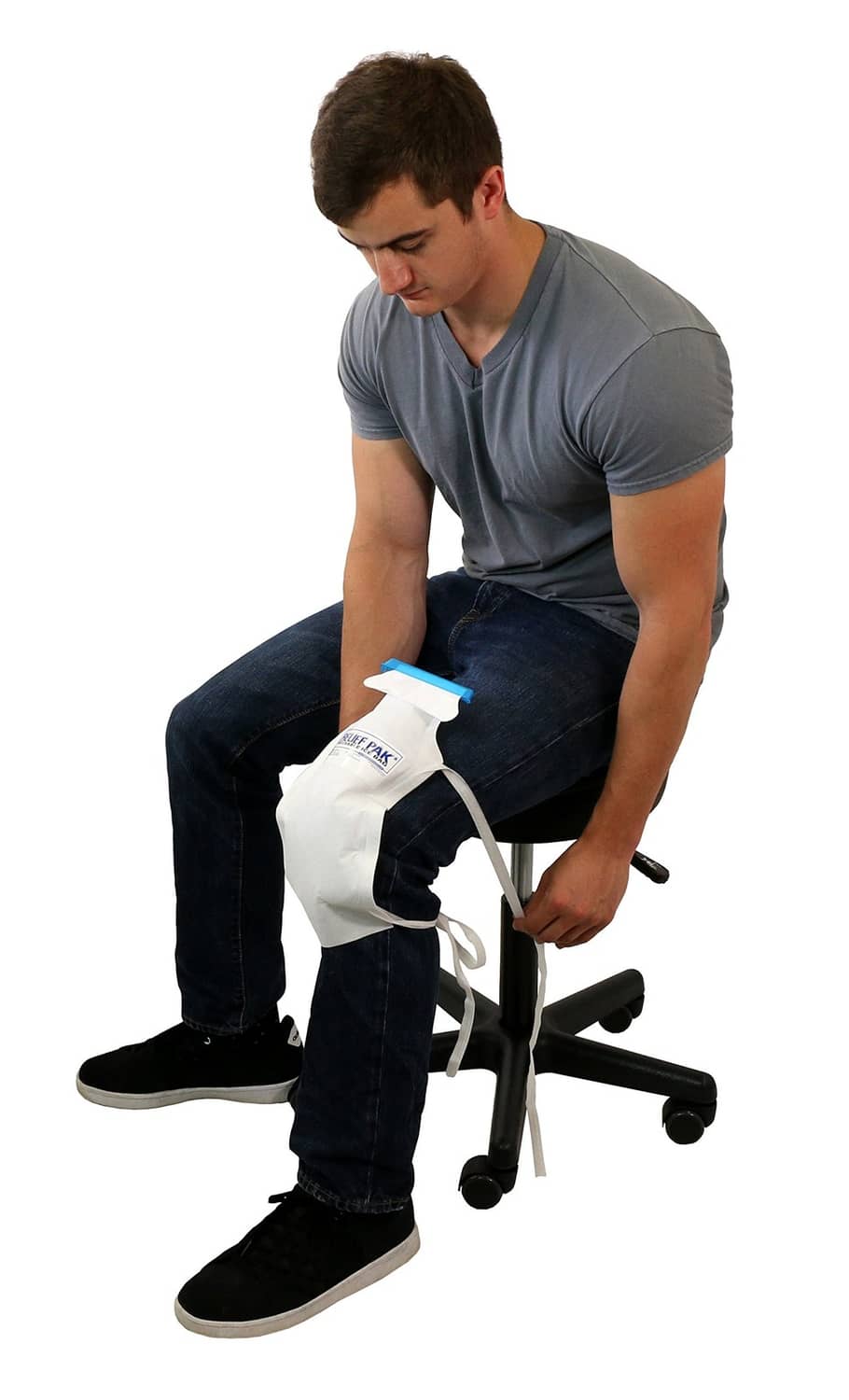 Large insulated ice bag with white tie strings and blue top tab, secured to leg