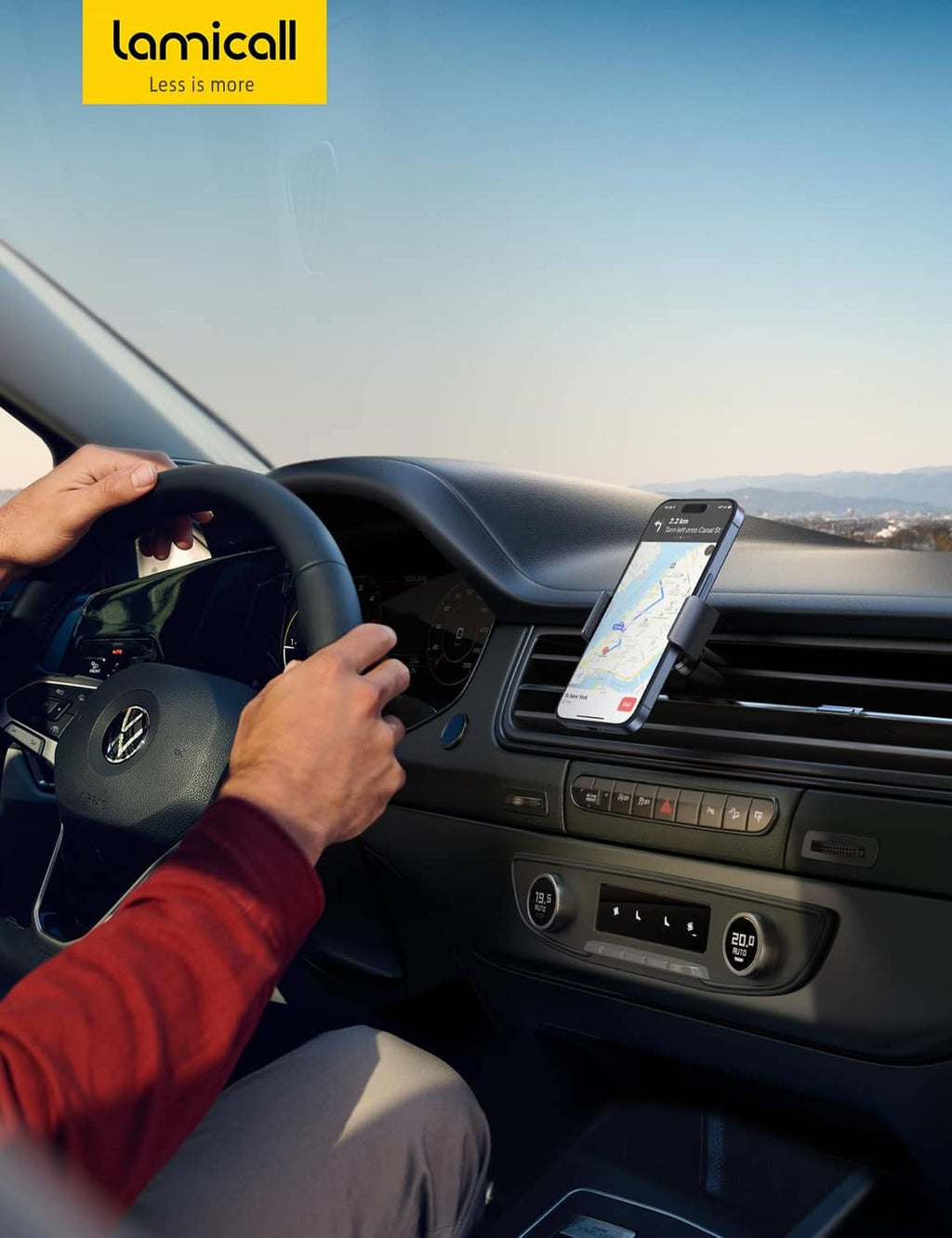 Car vent phone mount holding a smartphone on the dashboard air vent, black
