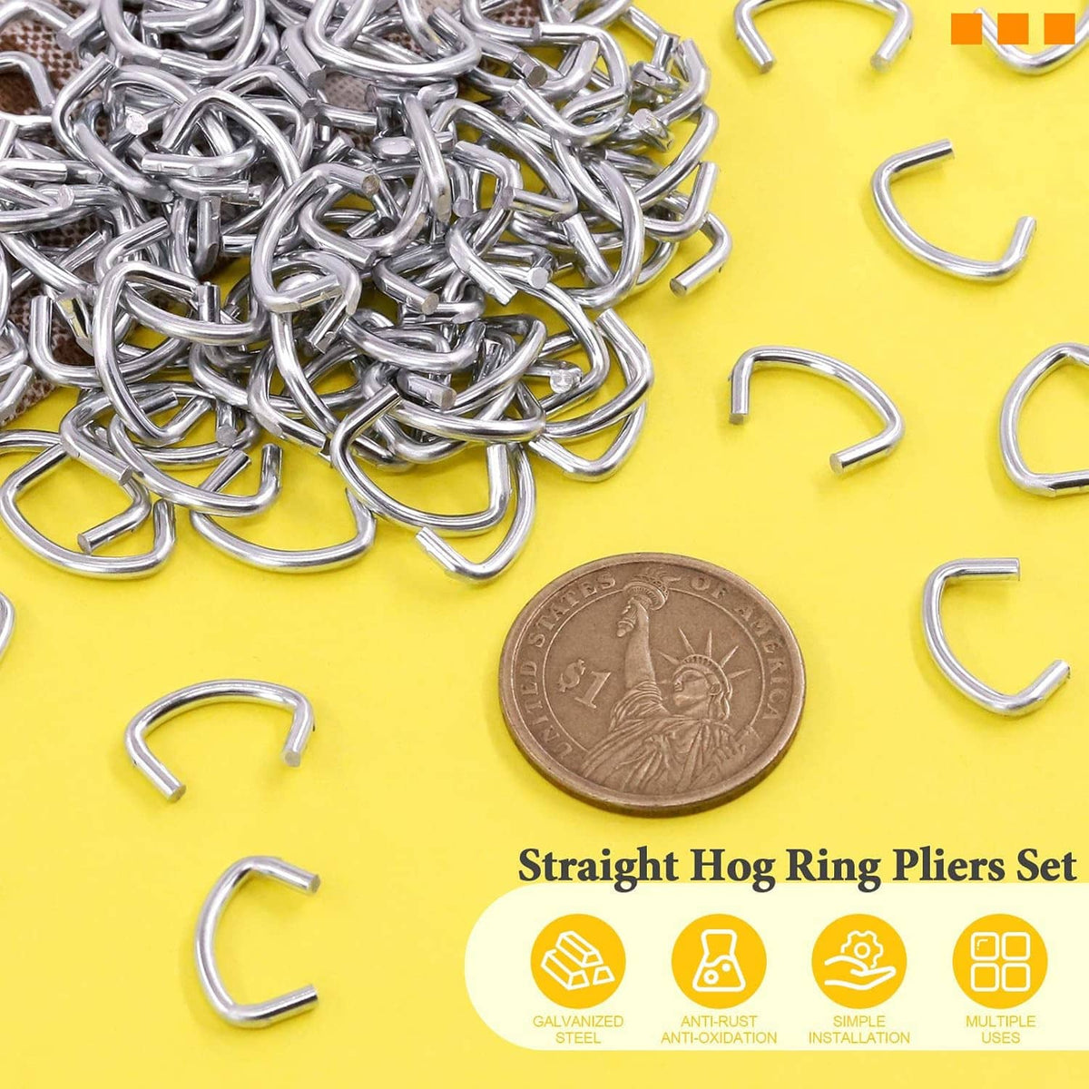 Pile of shiny galvanized hog rings with several U-shaped clips