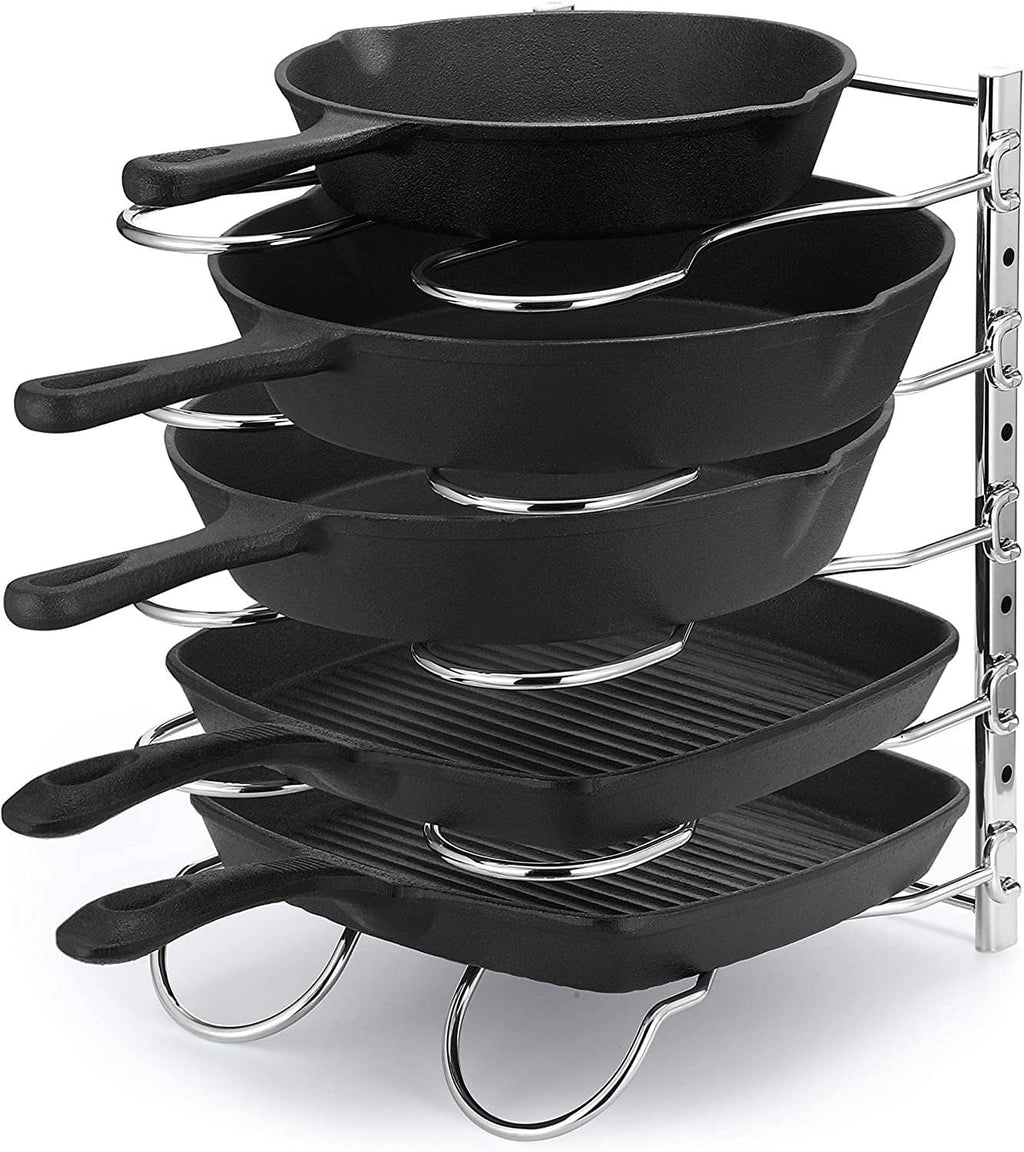 Kitchen cookware organizer rack with black pan holders and chrome rails and rings