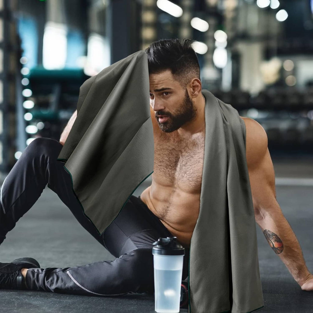 Microfiber towel draped over a man’s shoulder while relaxing at a gym bench
