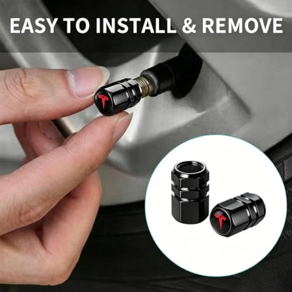 Black metal tire valve stem cap shown on a tire valve with red emblem