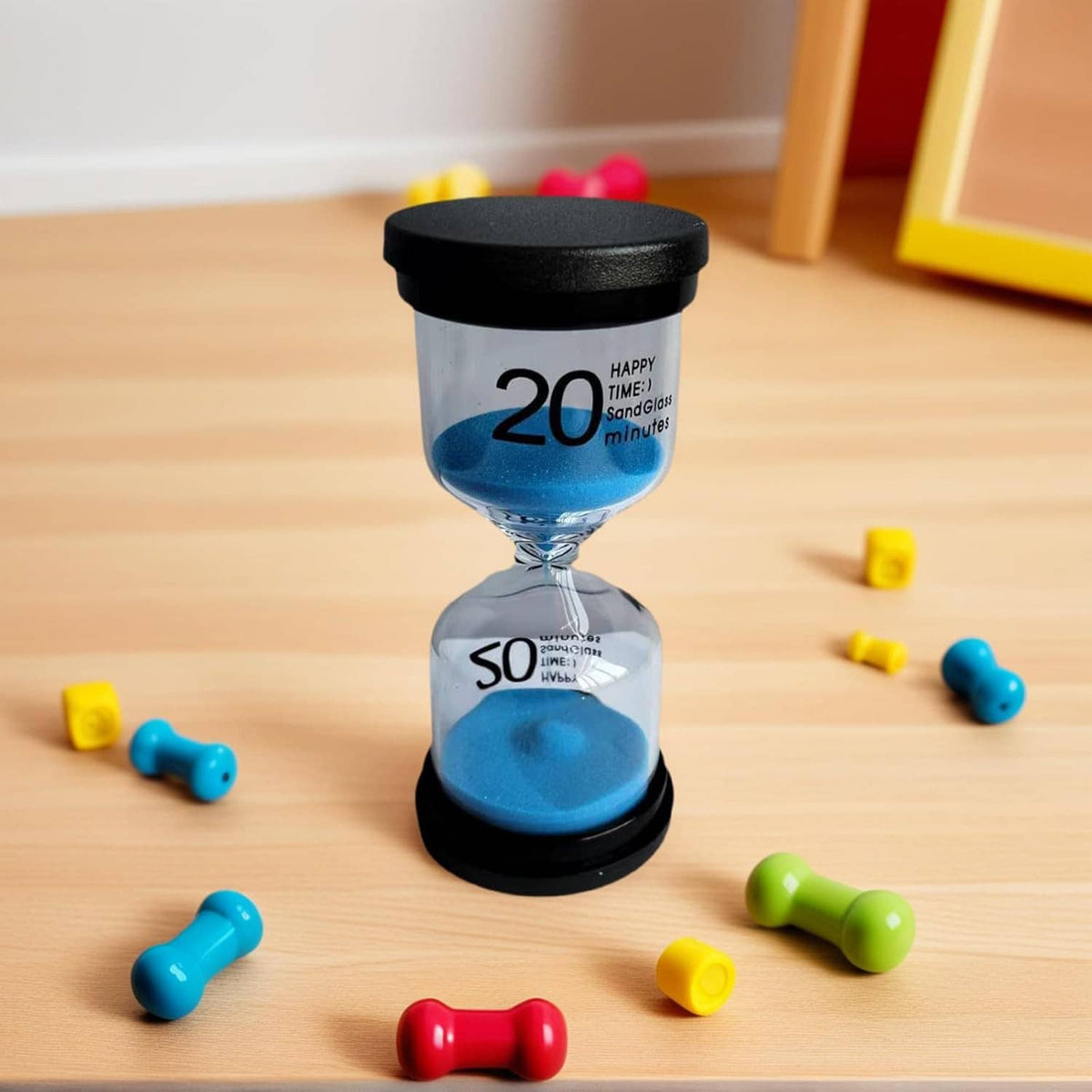Glass hourglass with blue sand, black top and base, 20 over 50 minutes