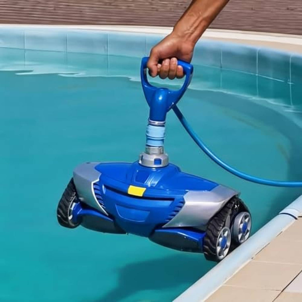Blue pool cleaner top cover with swivel assembly in water, gray inlet collar visible