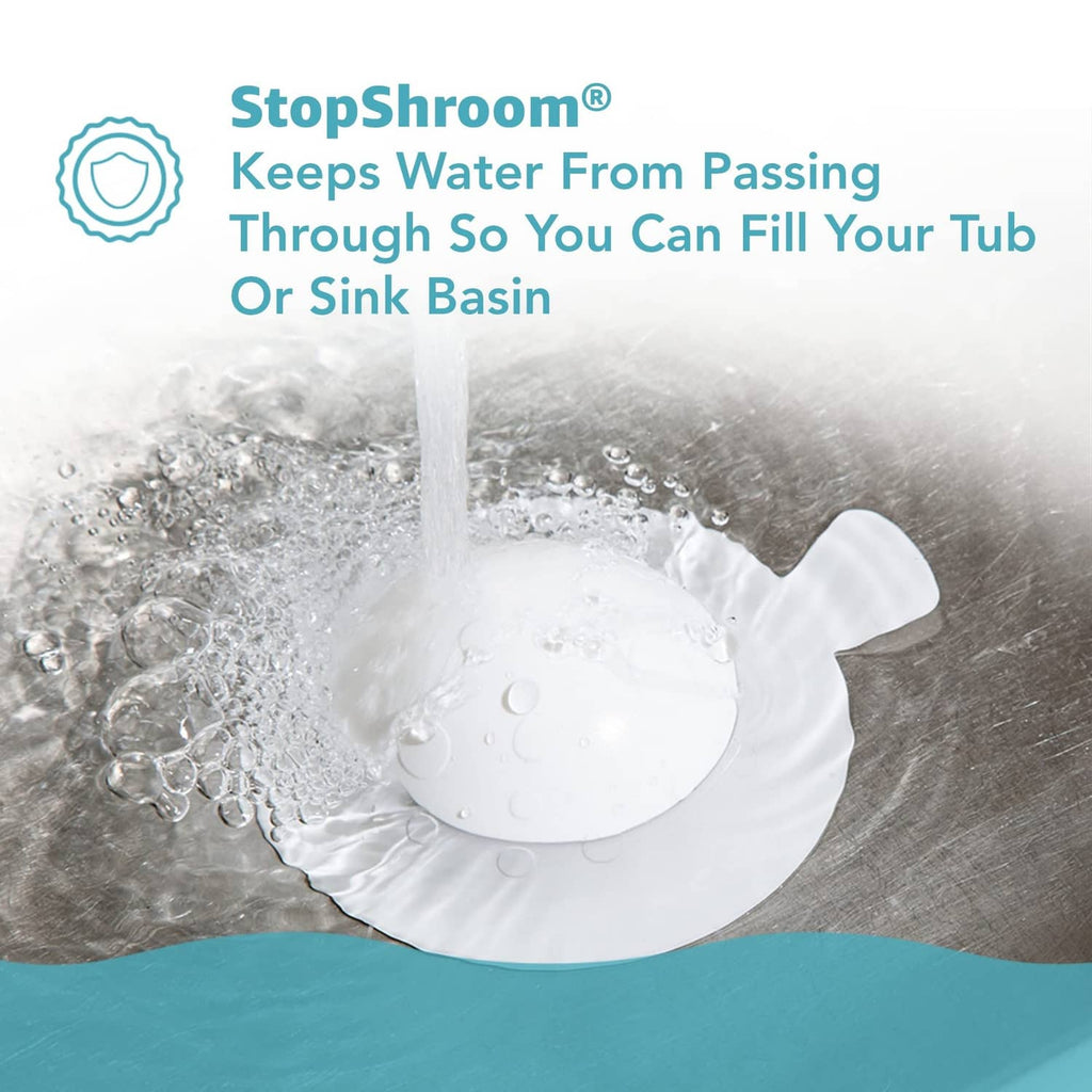 White mushroom-shaped silicone drain stopper covering bathtub drain to hold water