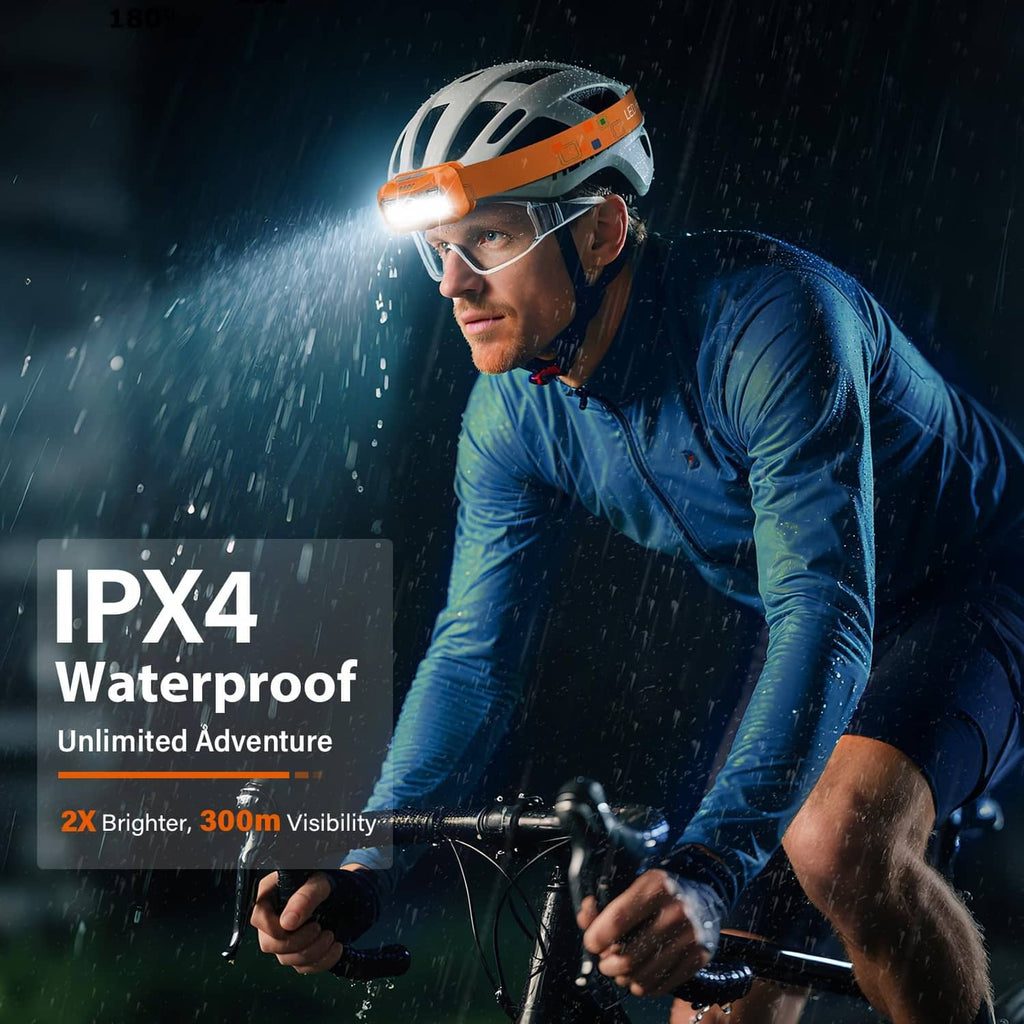Waterproof orange rechargeable headlamp worn on rider, three LEDs for visibility