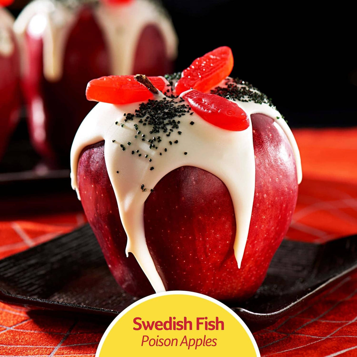 Apple with white chocolate drizzle, Swedish Fish gummy pieces and sprinkles