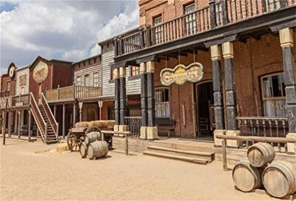 Western scenic photo backdrop with rustic buildings, barrels, and dusty street