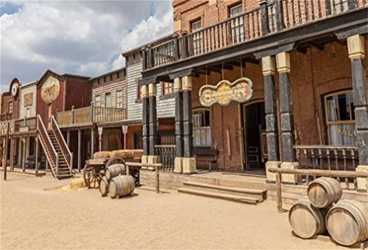 Western scenic photo backdrop with rustic buildings, barrels, and dusty street
