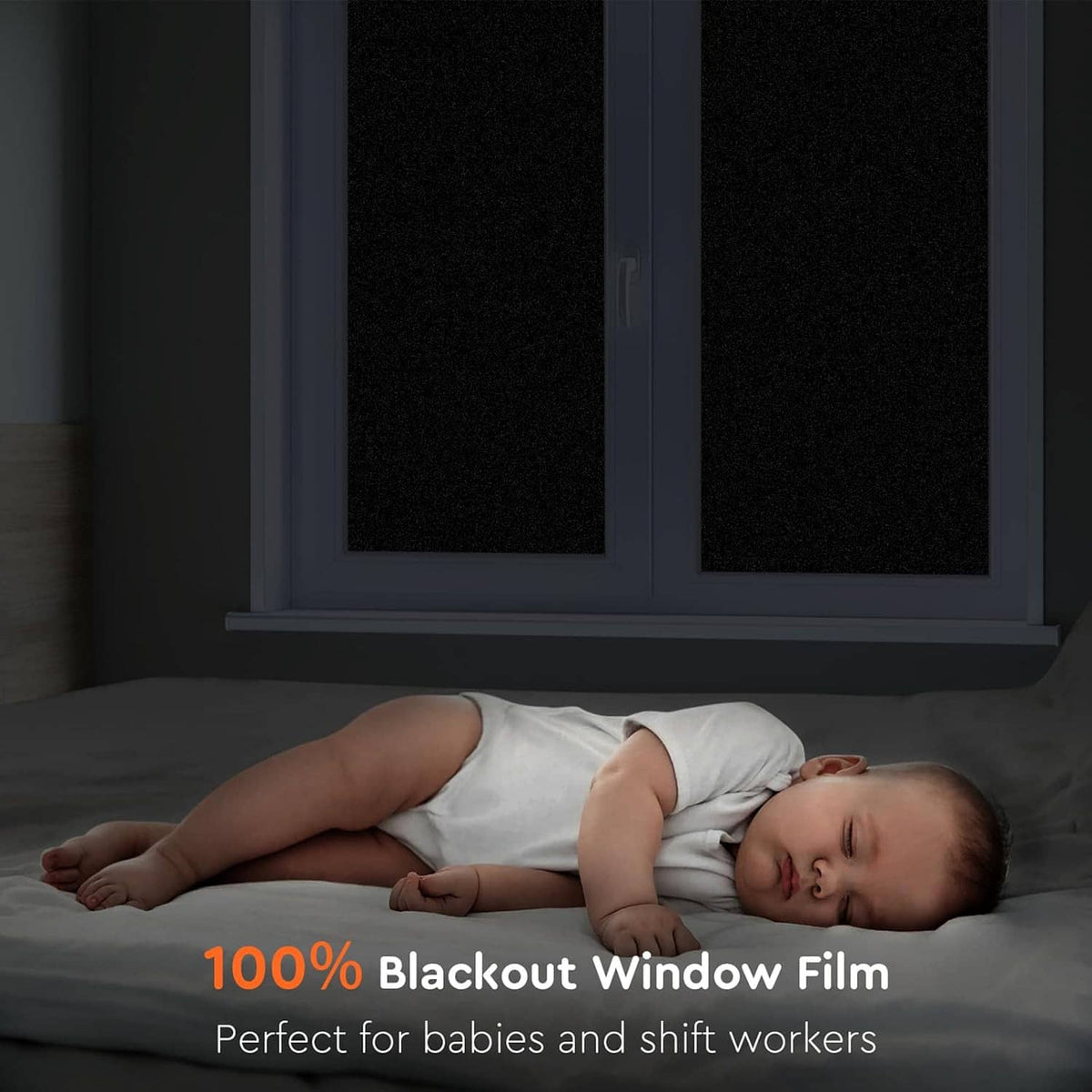 Blackout window film covering dark window panels to block light for privacy