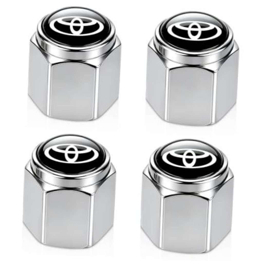 Silver metal tire valve stem cap with black top and Toyota emblem, hex shape