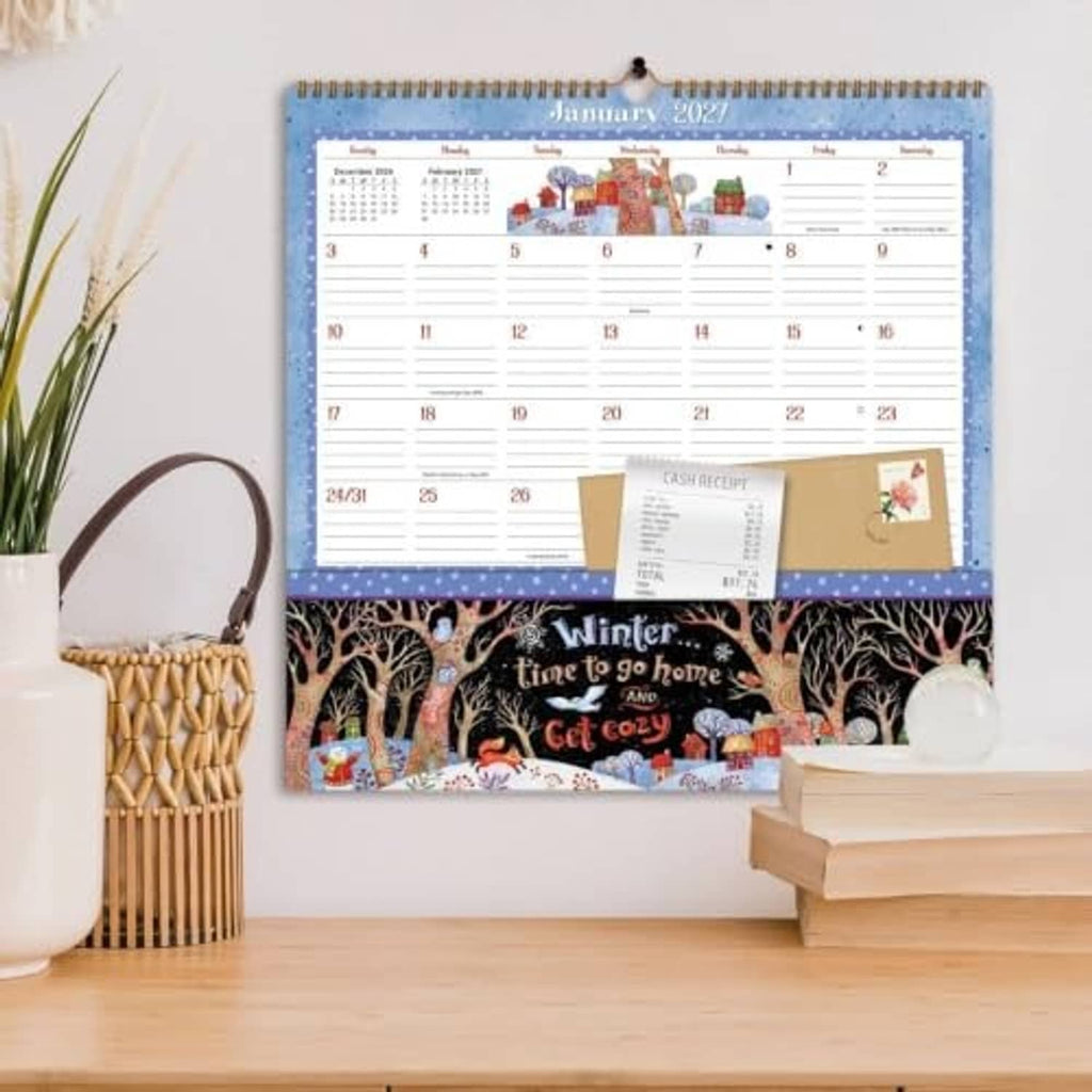 Spiral-bound desk calendar with January 2027 page and cash receipt card on tabletop