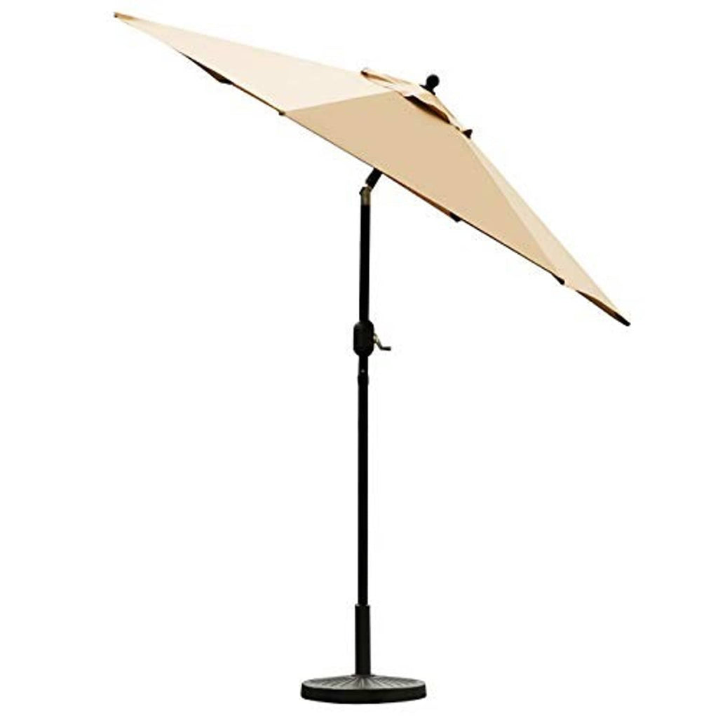 Tan outdoor umbrella angled open with black pole and round base