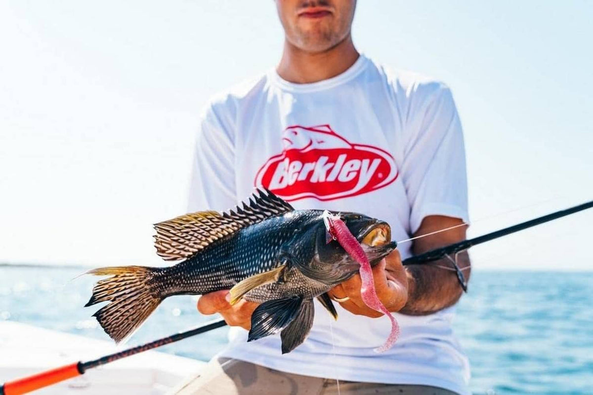 Pink soft bait lure on the fishing line during a catch