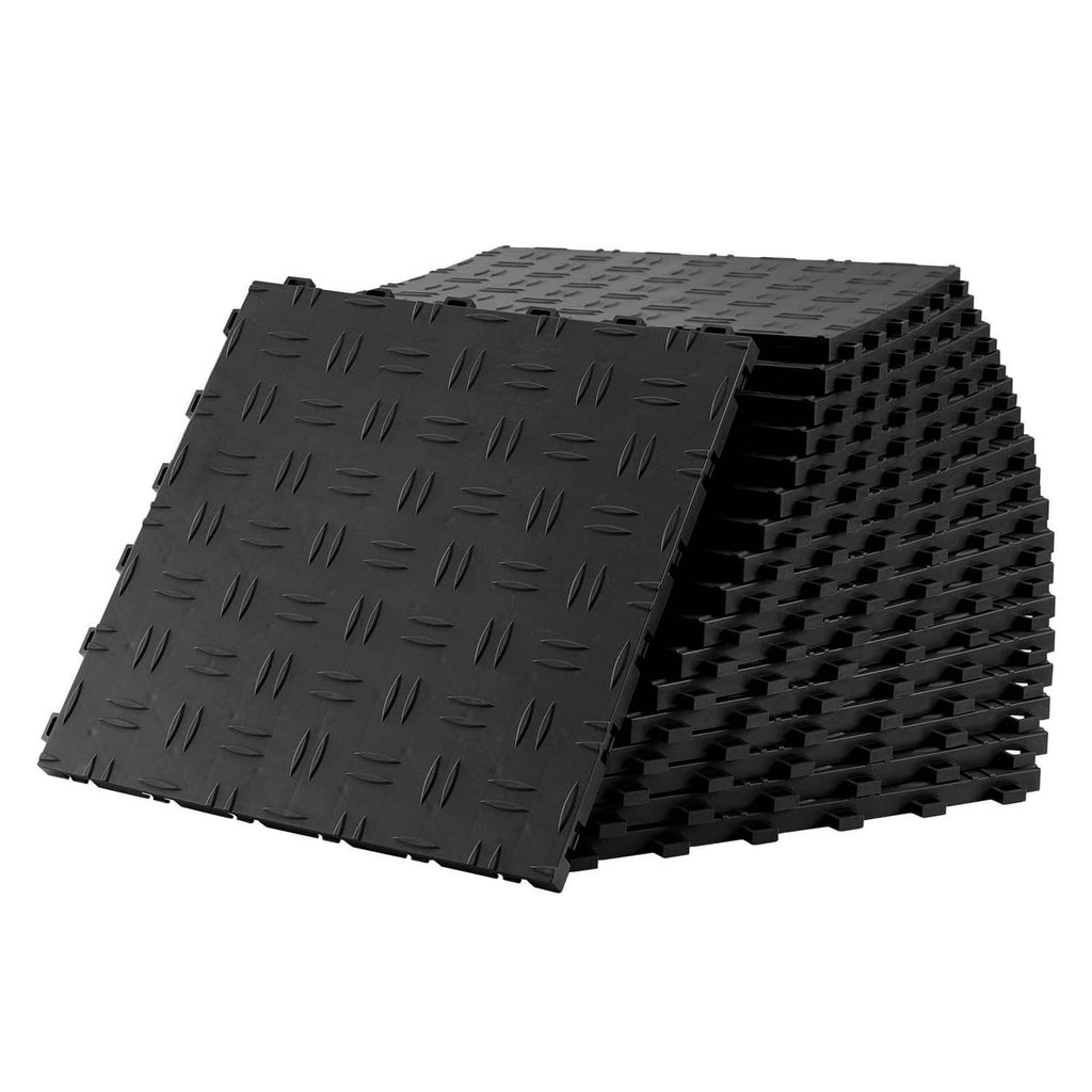 Stacked black interlocking garage floor tiles with textured diamond tread surface