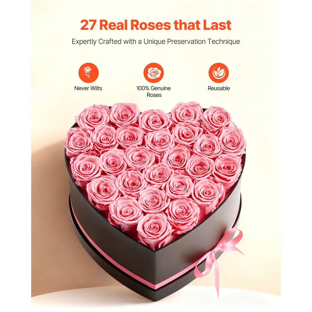 Heart-shaped rose gift box with pink preserved roses, black lid and pink ribbon