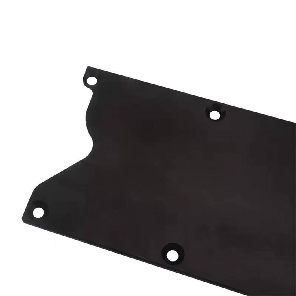 Close view of black knock sensor delete plate with rounded cutouts and bolt holes
