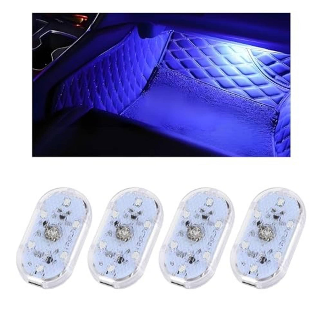 Blue LED interior floor lights shining on quilted car mat surface