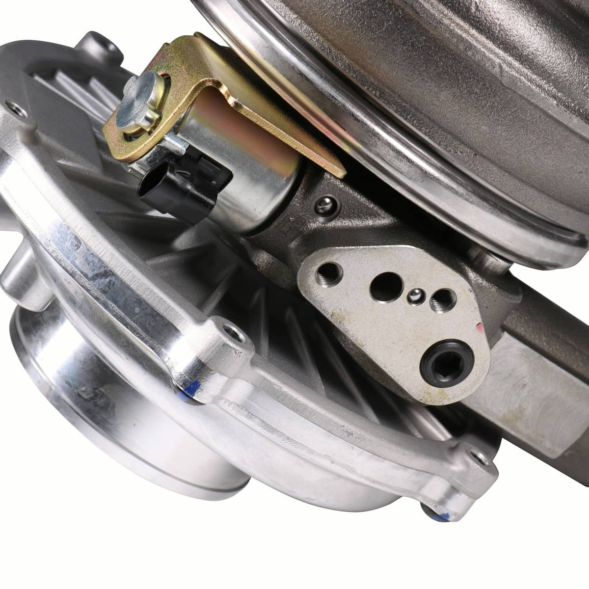 Turbocharger assembly with metallic housing, mounting brackets, and multiple connection ports