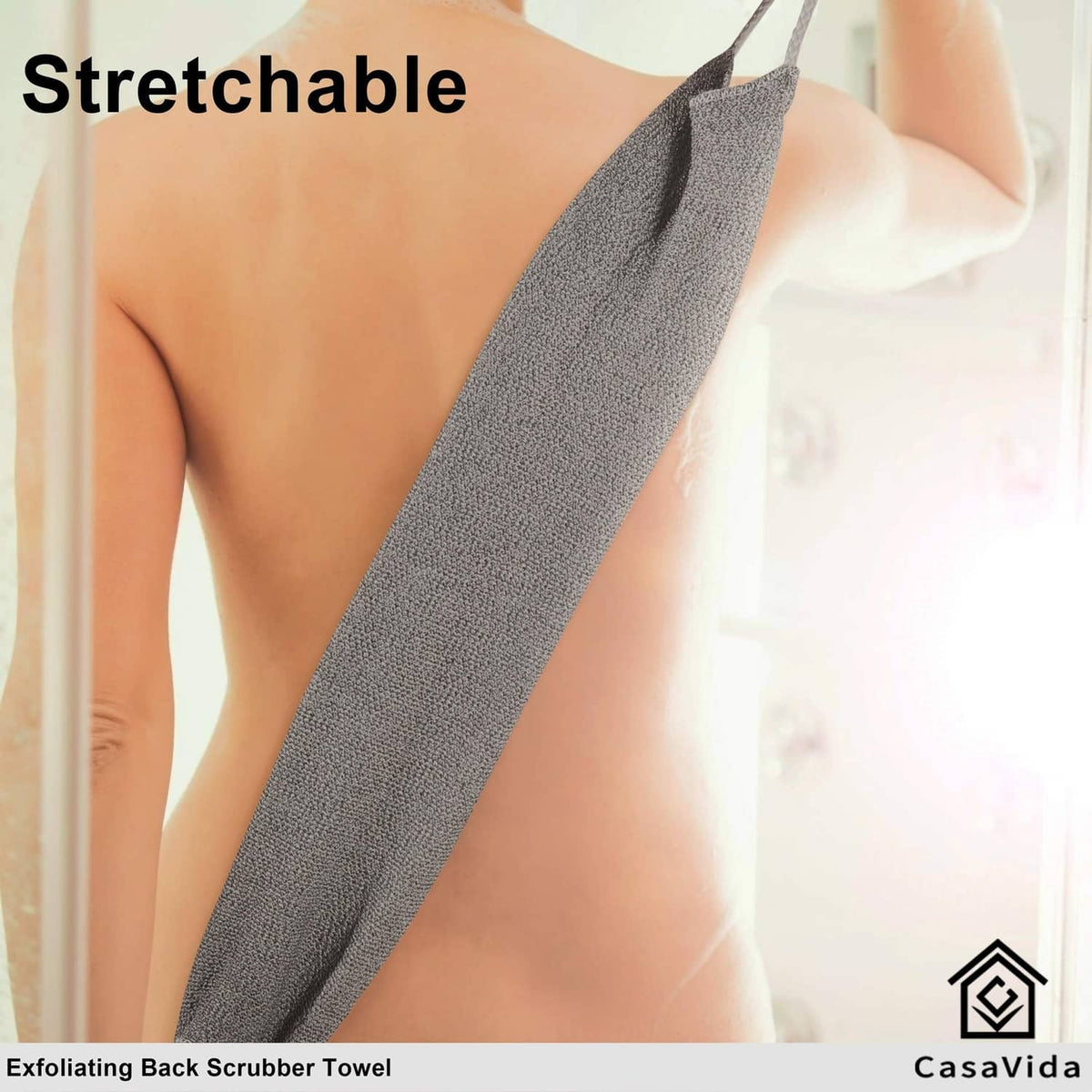 Stretchable dark gray exfoliating back scrubber towel laid across shoulders