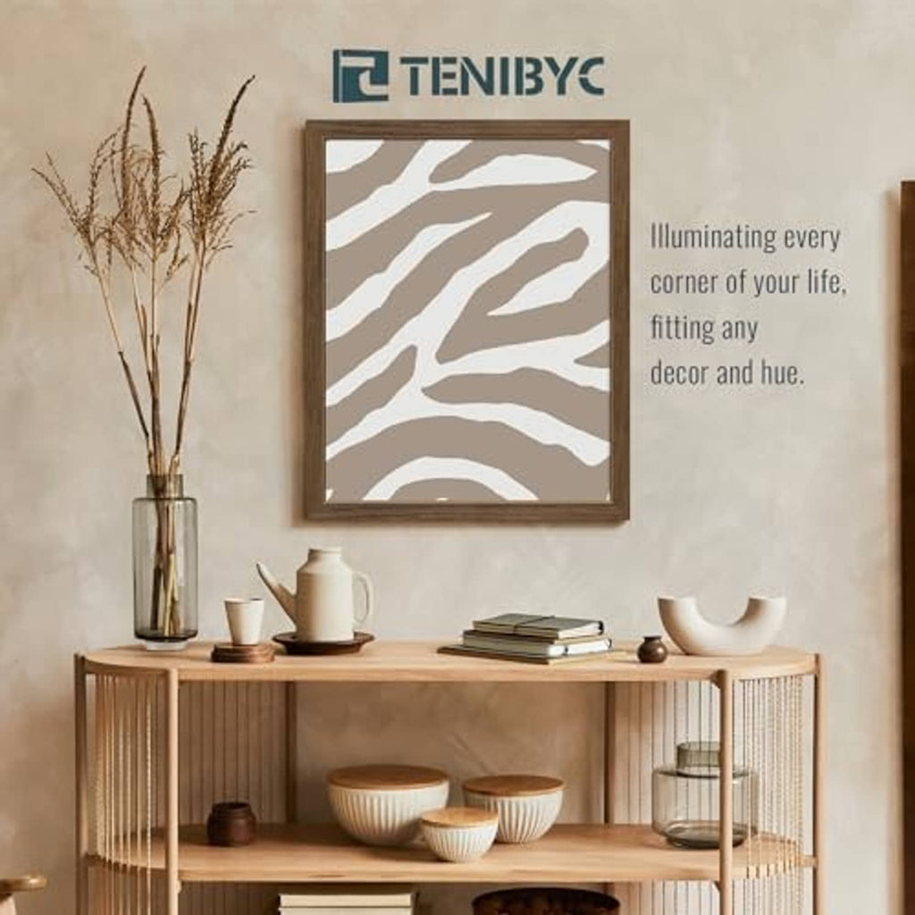 Brown woodgrain 16x20 picture frame on wall with zebra-stripe style artwork