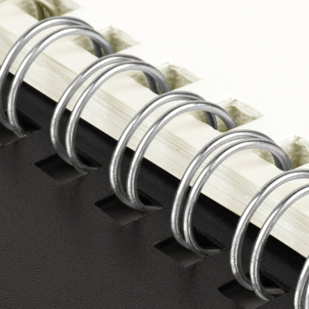 Metal spiral binding with black cover on a 2027 monthly planner