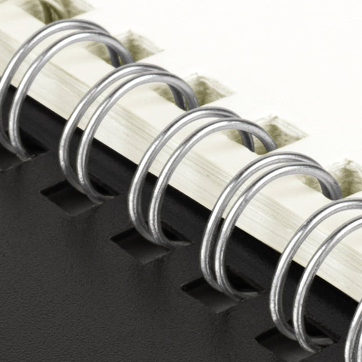 Metal spiral binding with black cover on a 2027 monthly planner