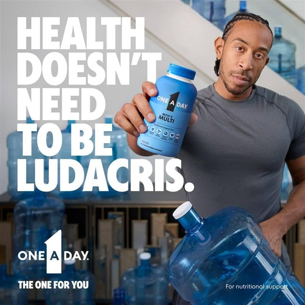 Women’s multivitamin bottle held in hand with blue supplement bottle in background