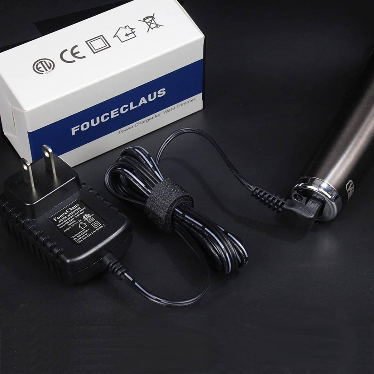 Black power adapter charger set with coiled cable and box packaging