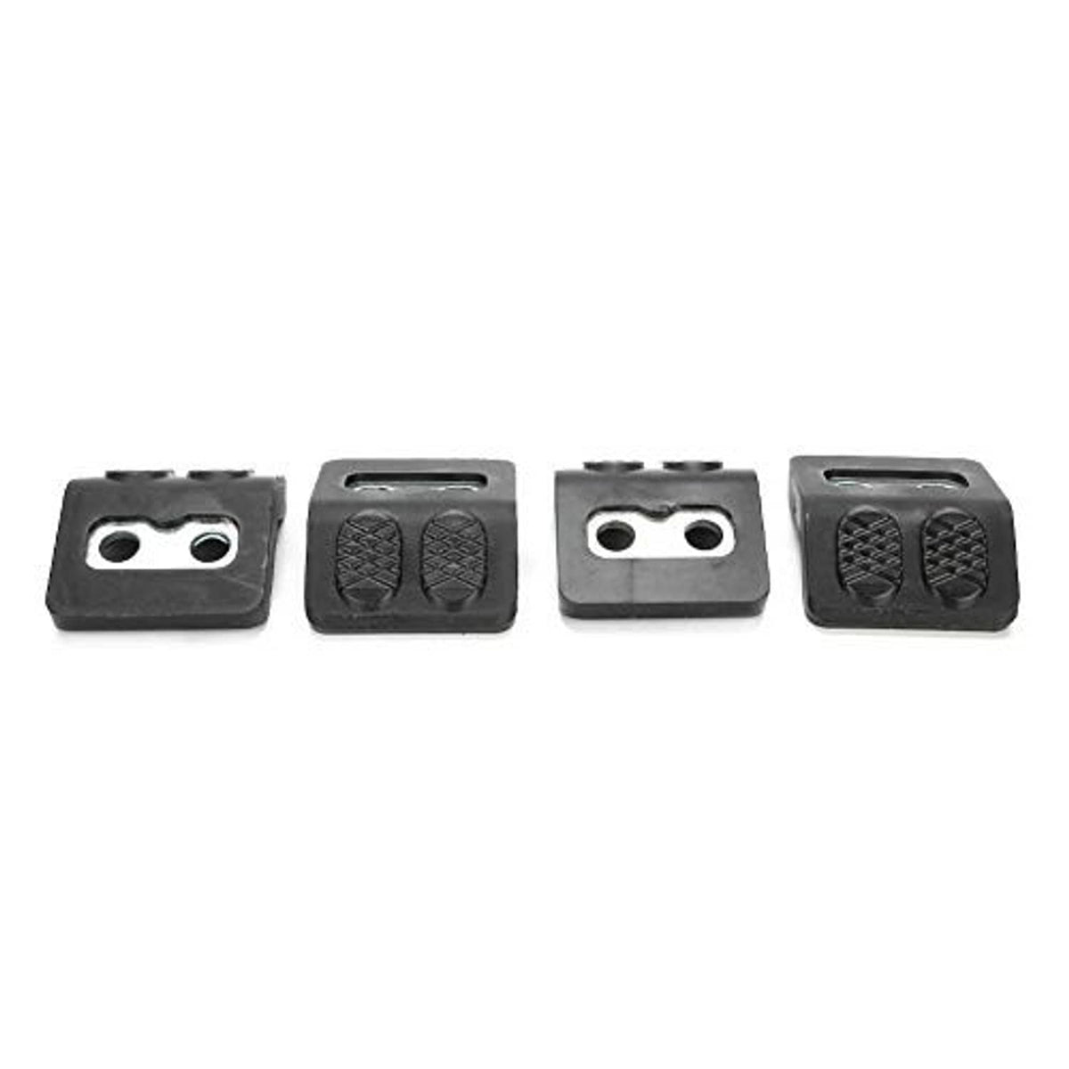 Four black tire changer jaw protectors showing silver two-hole metal inserts