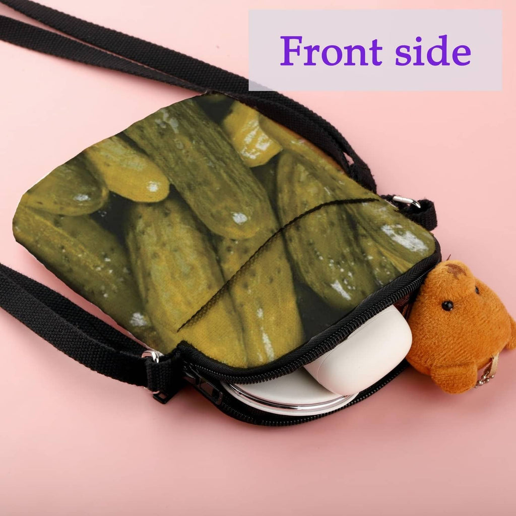 Pickle-print crossbody bag with black strap and side zipper opening