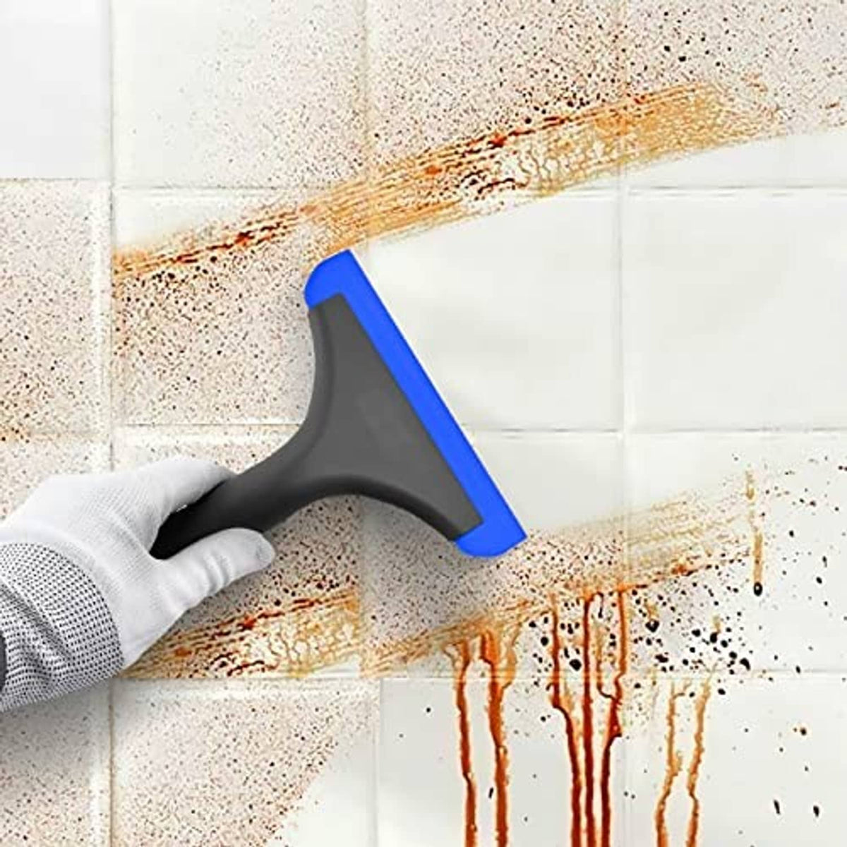 Blue-and-black window squeegee scraping grime from glass surface