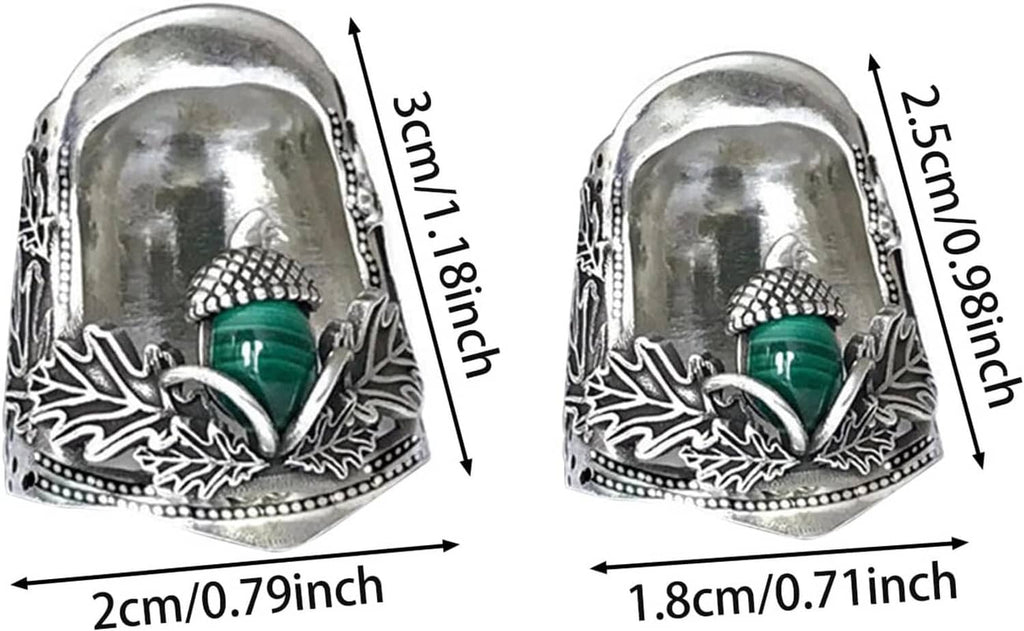 Two acorn open nail thimbles shown side by side, green center, engraved silver
