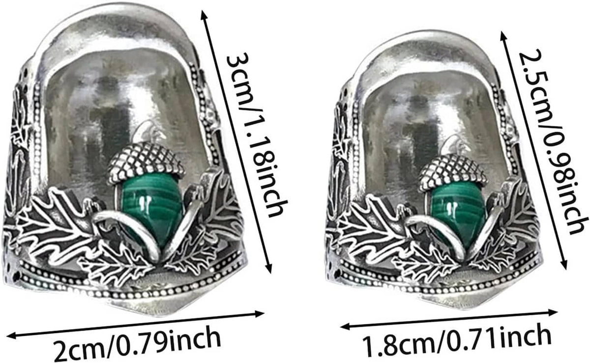 Two acorn open nail thimbles shown side by side, green center, engraved silver