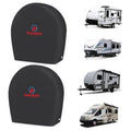 Set of 2 black dome-style RV tire covers, fitted for outdoor storage, with logo