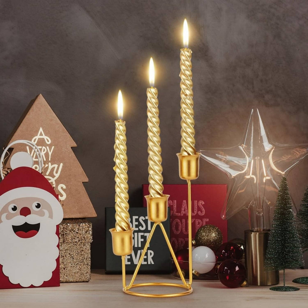 Gold iron three-candle holder with three twisted candles and cup bases