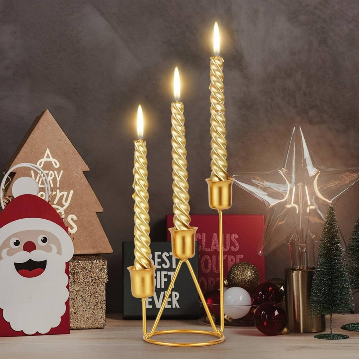 Gold iron three-candle holder with three twisted candles and cup bases