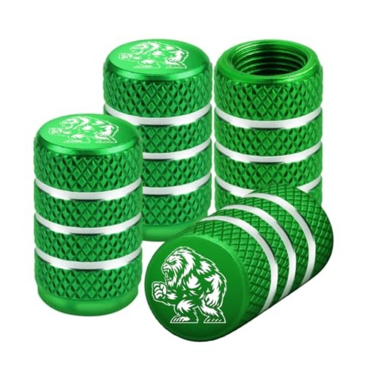 Four green Yeti tire valve stem caps, textured diamond grip with silver stripe rings.