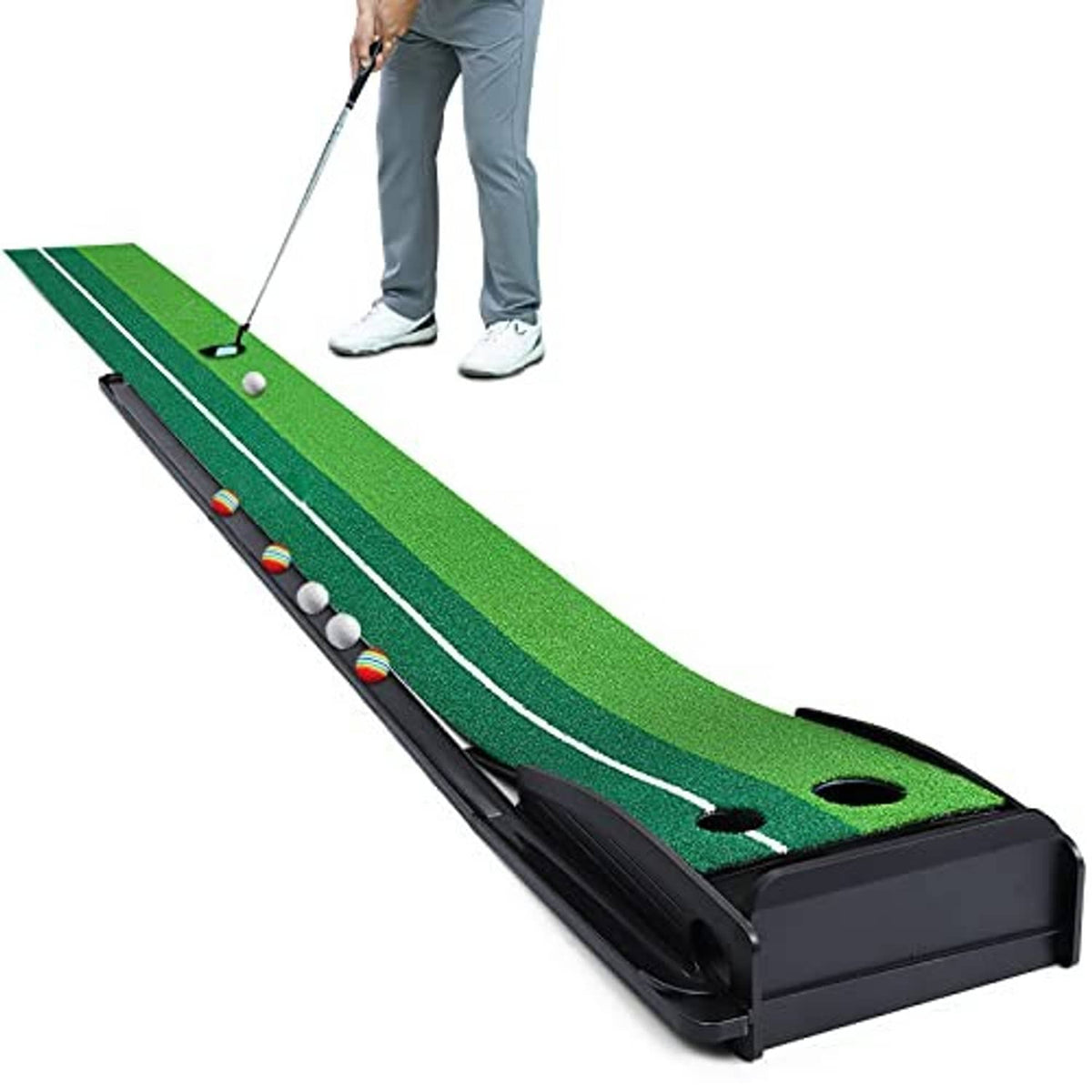 Portable golf putting mat with green turf, black ramp base, and multiple colored practice balls