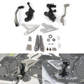 Motorcycle driver foot peg bracket kit with silver pegs, black mounts, and hardware set