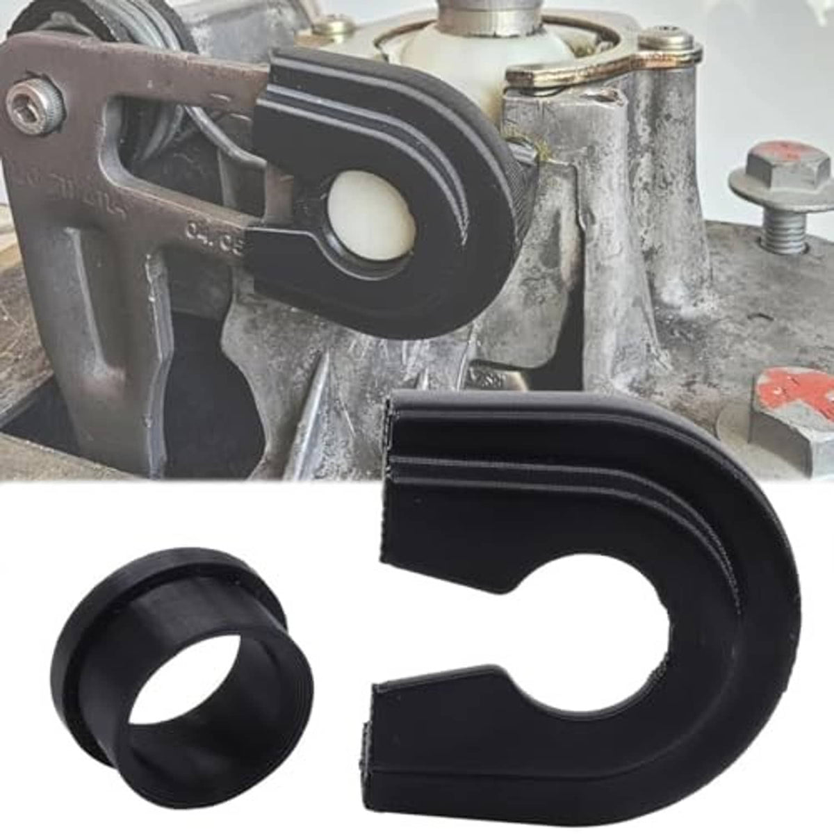 Gearbox repair kit parts installed on transmission housing, black rings and spring