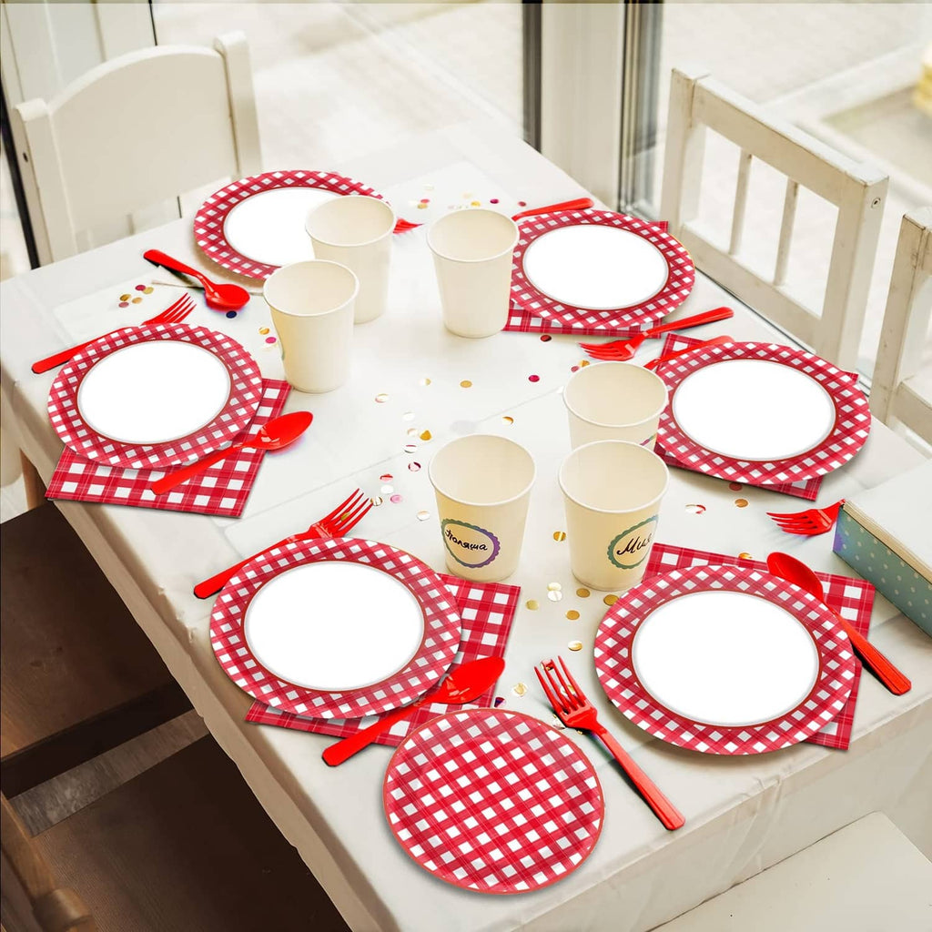 Red and white gingham party table setting with plates, napkins, cups, and forks