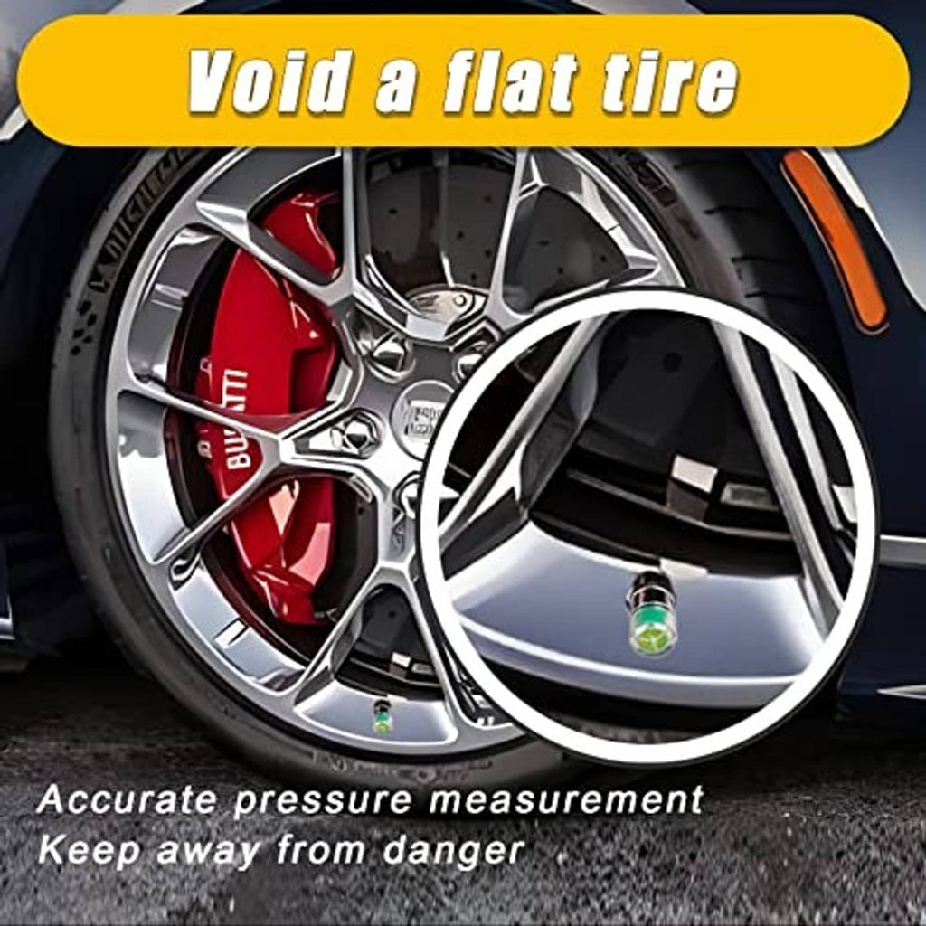 Tire with installed silver valve stem cap showing clear window and green/red band