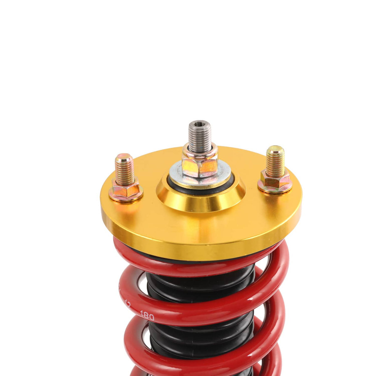 Close-up of coilover top cap with gold plate, threaded bolts, and red spring.