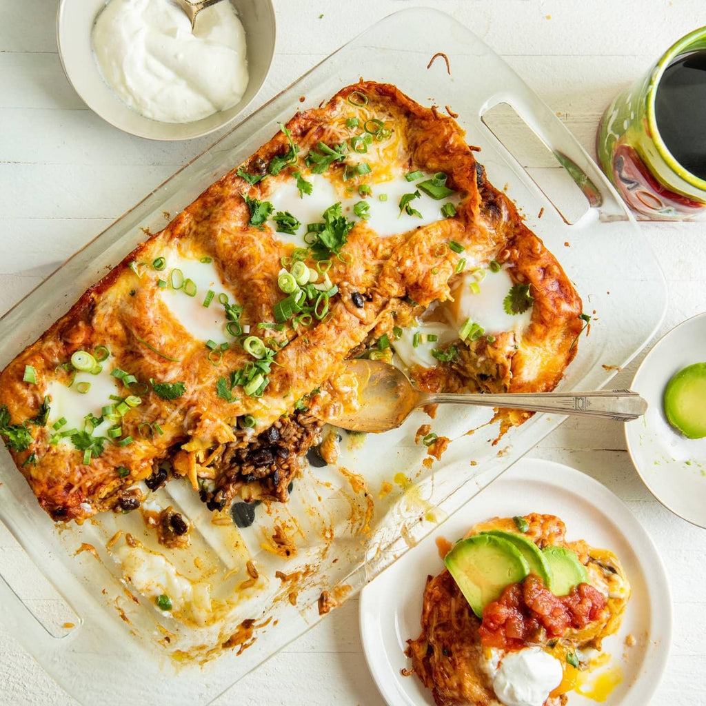 Serving of black beans and rice topped with herbs, in a casserole dish
