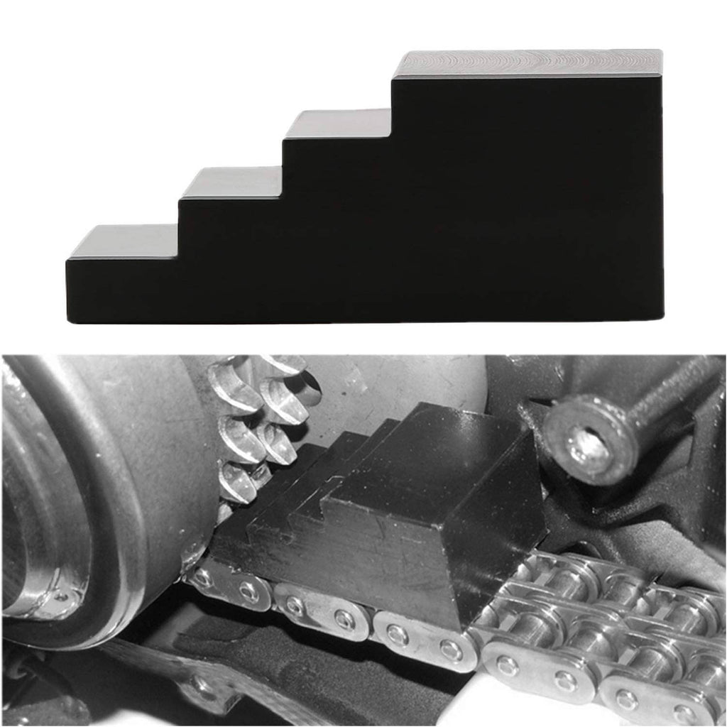Black stepped locking tool seated on transmission components with bolts