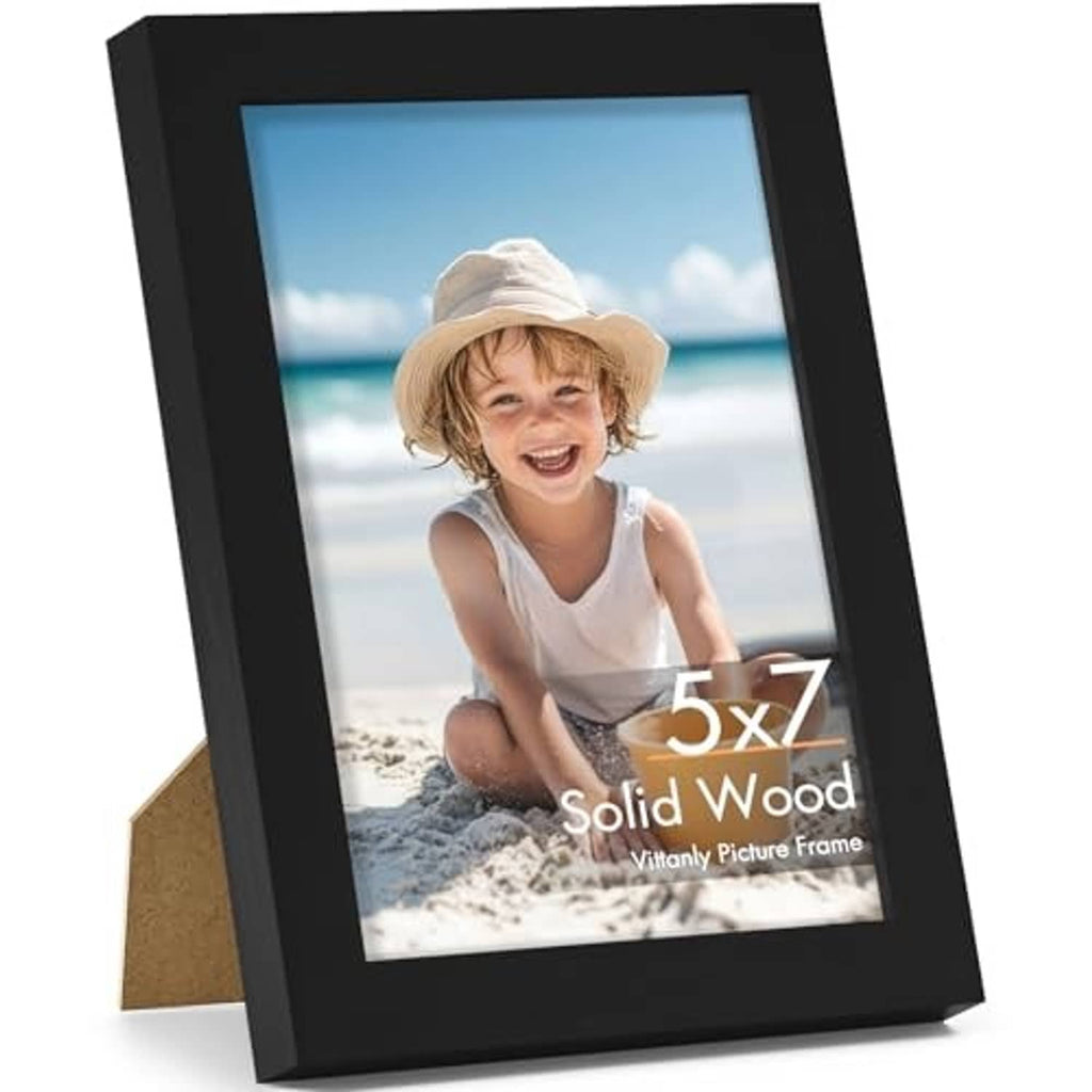 Black 5x7 solid-wood picture frame with clear shatterproof plexiglass, angled front view.