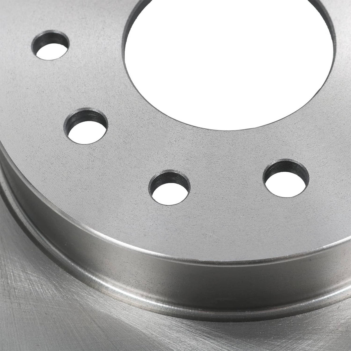 Rear rotor close-up showing machined disc surface and evenly spaced bolt holes