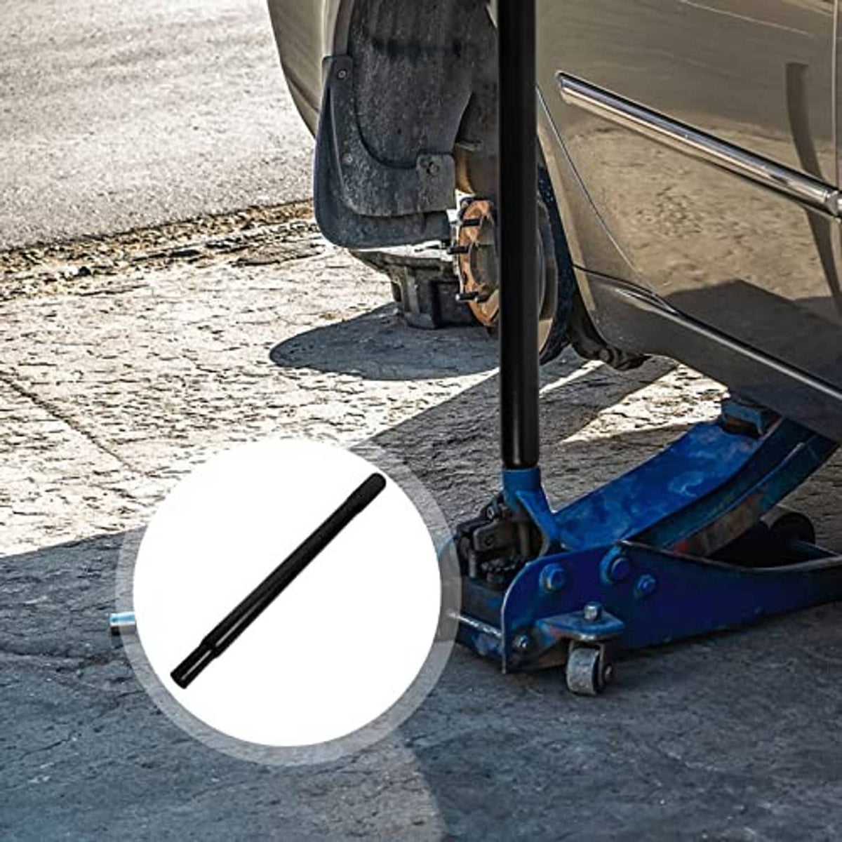 Black floor jack handle lever in use near vehicle lift