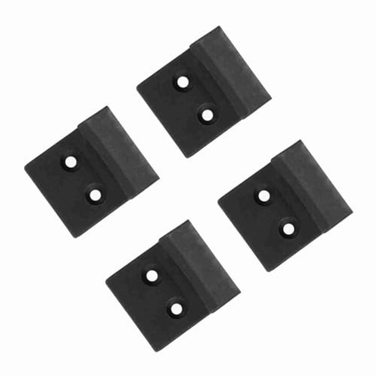 Four black tire changer jaw protector guards with two circular holes each